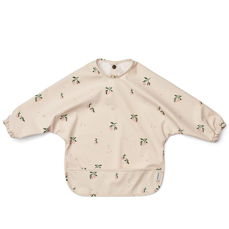 Langarmlätzchen für Kinder in Beige mit Pfirsichmuster von Liewood. 