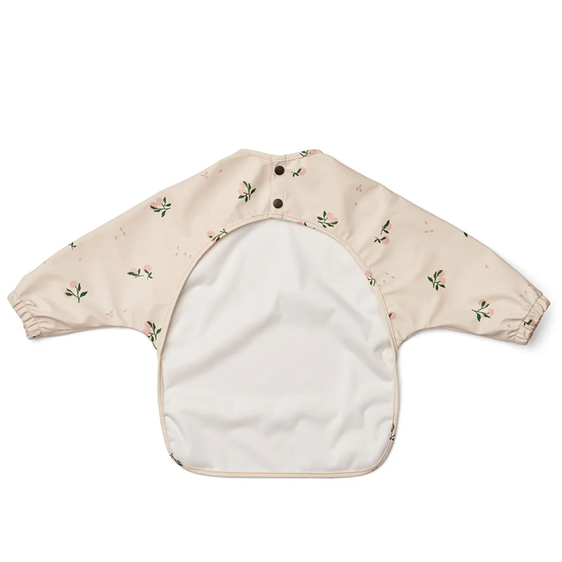 Langarmlätzchen für Kinder in Beige mit Pfirsichmuster von Liewood. 